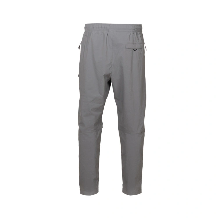 pantalon-largo-nike-fc-barcelona-woven-tech-fanswear-2025-2026-smoke-grey-lt-smoke-grey-lt-smoke-grey-no-spo-1